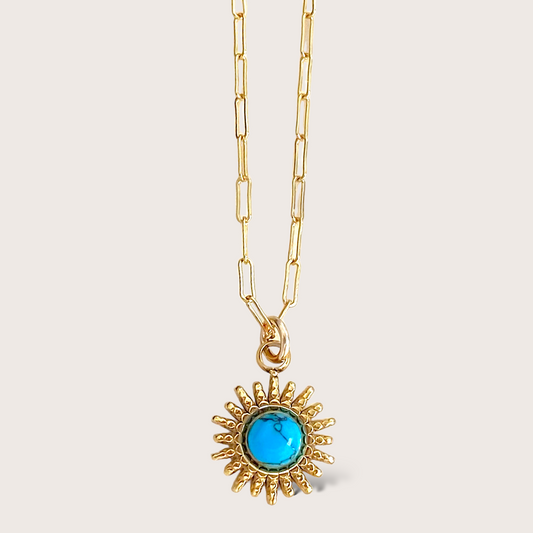 Gold Sun Pendant Necklace. Featuring an eye-catching sun shape turquoise pendant on a 14K gold chain, it's perfect for adding a pop of color to any outfit. Made with waterproof materials for everyday wear, get ready to turn heads with this modern gemstone magic.