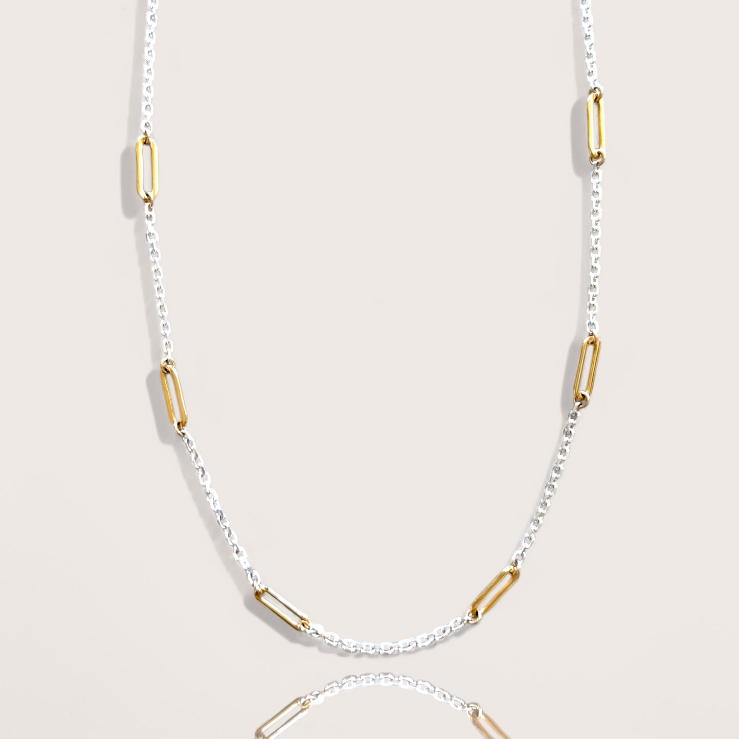 Two-tone necklace with sterling silver diamond-cut chain and gold paperclip links, 15-inch length 