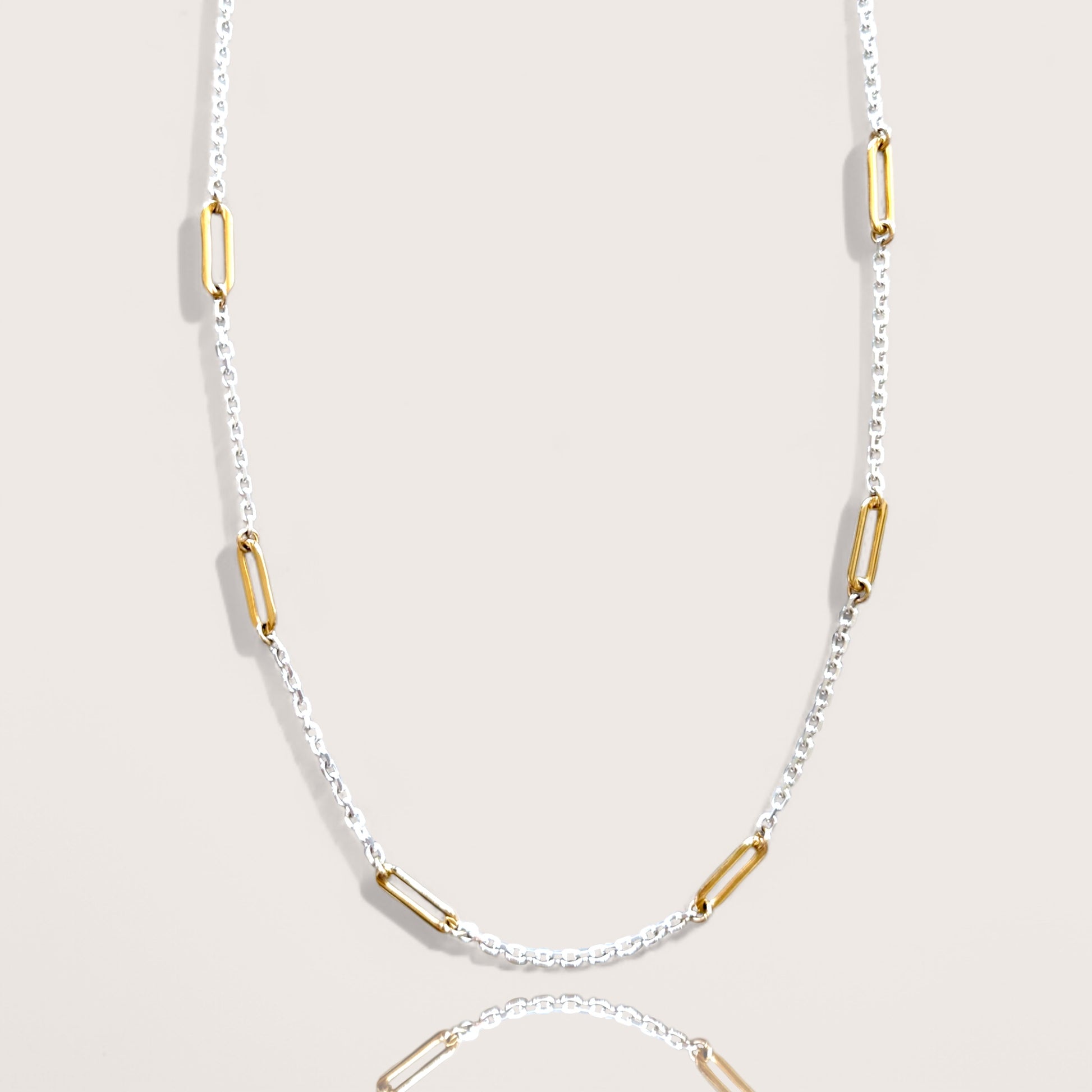 Two-tone necklace with sterling silver diamond-cut chain and gold paperclip links, 15-inch length 