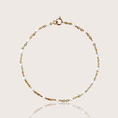 White Enamel Bead Station Bracelet, in 14K yellow Gold Filled, waterproof and tarnish resistant gold.