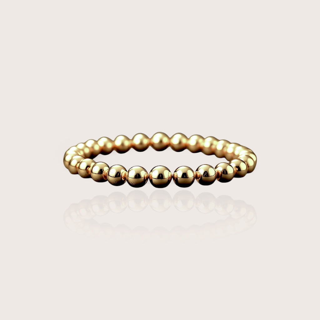 Kids 4mm Gold Beaded Bracelet on model