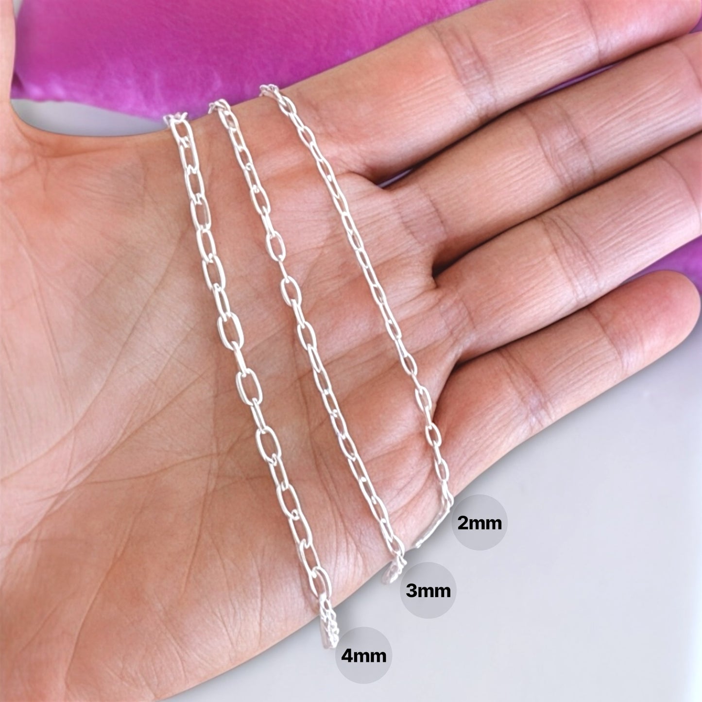Close up of heavy duty Italian  solid 925 sterling silver mariner chain in a hand by AshleyNicole Jewelry