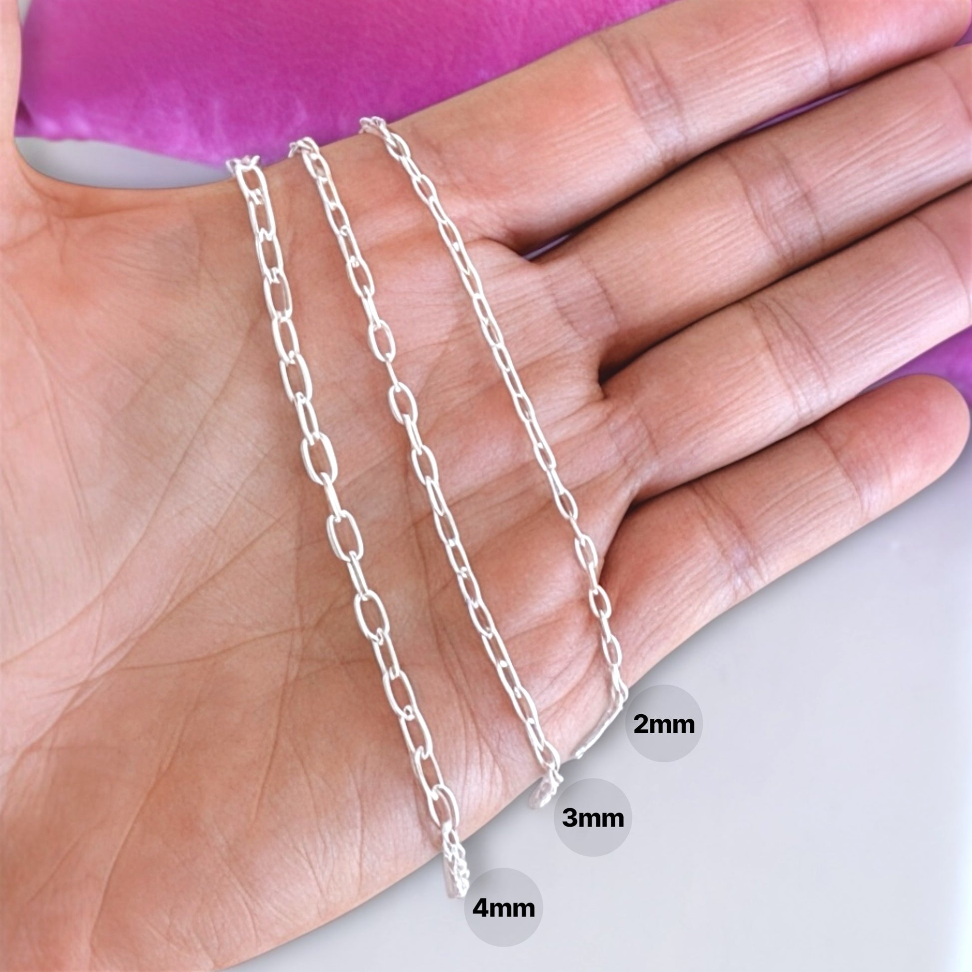 Close up of heavy duty Italian  solid 925 sterling silver mariner chain in a hand by AshleyNicole Jewelry