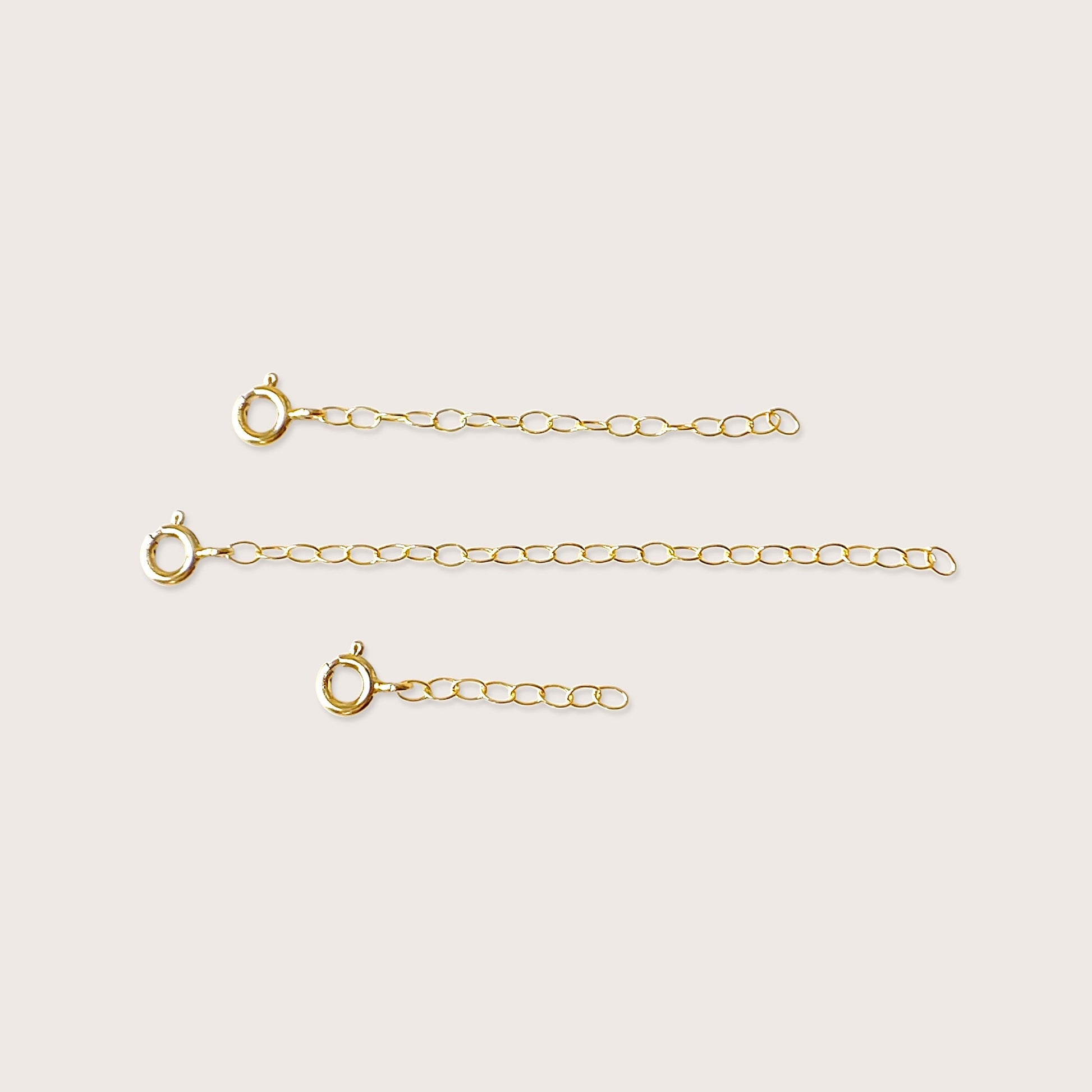 14K Gold Filled Necklace Extender showing the spring-ring clasp and multiple size options on a clean studio background.