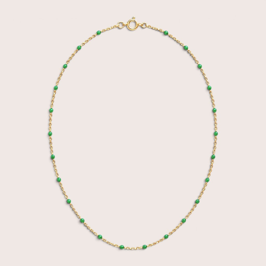 Emerald green enamel station beads spaced along a gold-filled necklace