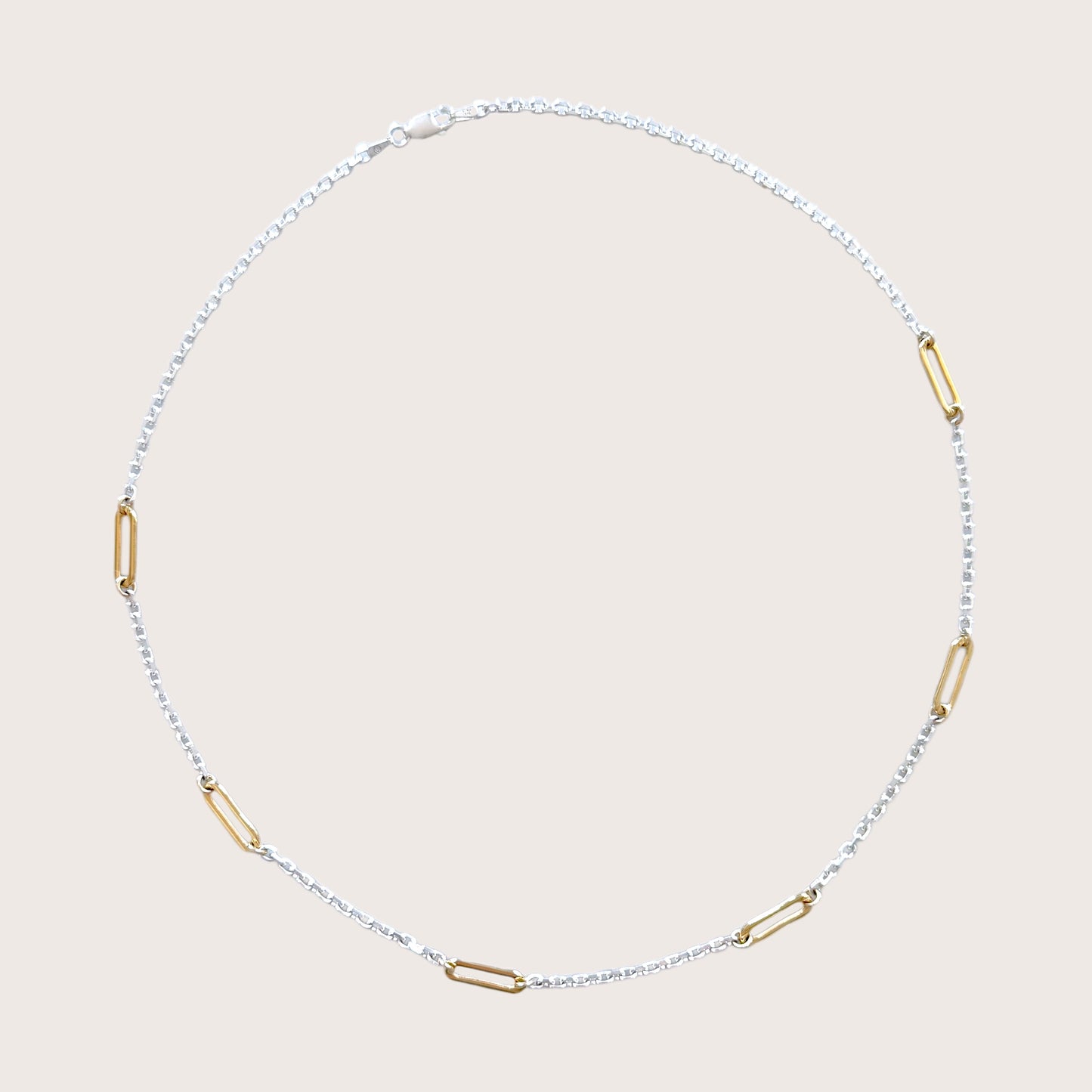Sterling silver and gold necklace available in multiple lengths, shown in 15 to 20 inches