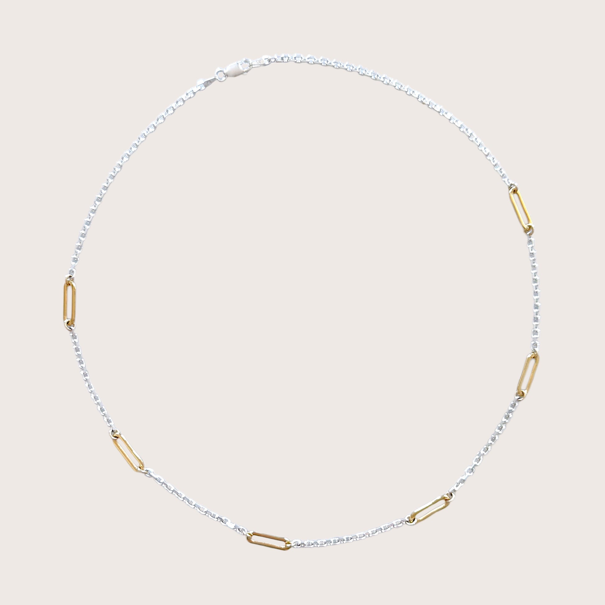 Sterling silver and gold necklace available in multiple lengths, shown in 15 to 20 inches