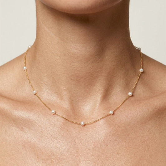 Model wearing the 16-inch gold-filled freshwater pearl station necklace