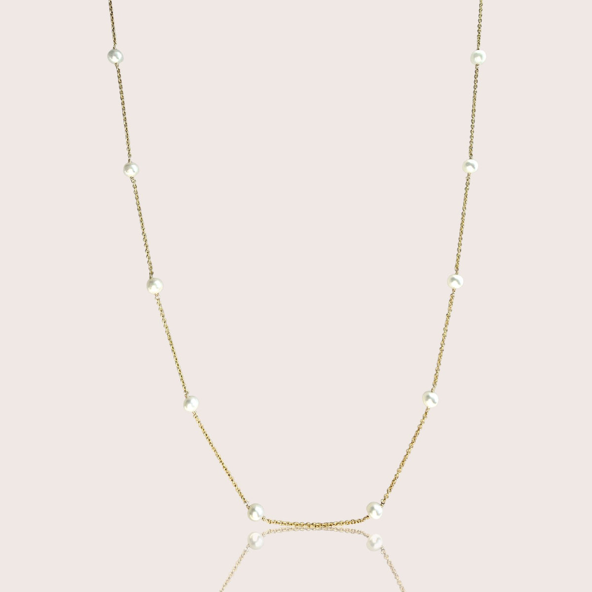 Freshwater pearl station necklace with white pearls spaced along a delicate gold-filled chain