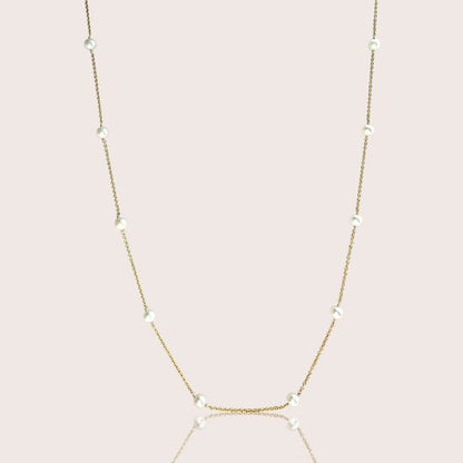 Freshwater pearl station necklace with white pearls spaced along a delicate gold-filled chain