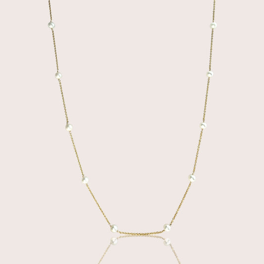 Freshwater pearl station necklace with white pearls spaced along a delicate gold-filled chain