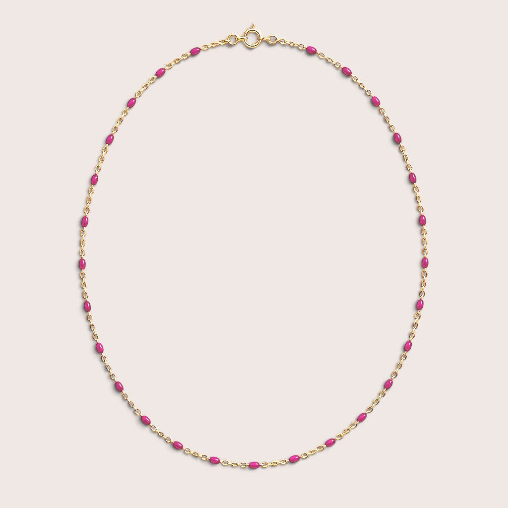 Fuchsia enamel station beads spaced along a gold-filled necklace