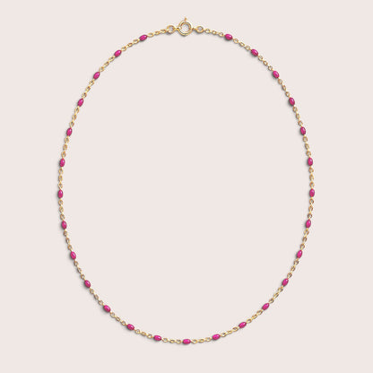 Fuchsia enamel station beads spaced along a gold-filled necklace