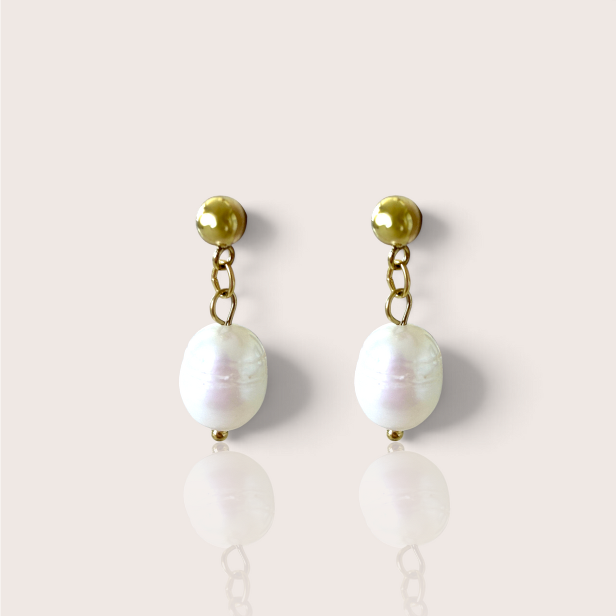 Gold freshwater baroque pearl drop earrings featuring a 5mm ball stud on a light background