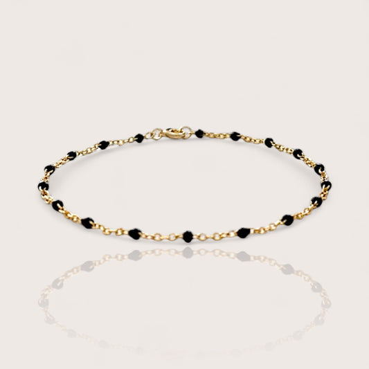 Dainty Station Bracelet in 14k gold filled chain with black enamel resin beads spaced out evenly with a spring-clasp closure