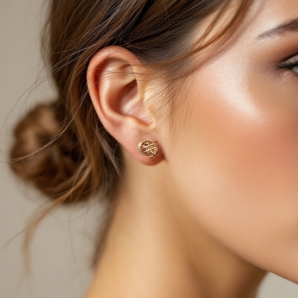 Lifestyle photo of a model wearing the intricate silver love knot stud earrings to scale on her earlobe while elegantly holding her hand near her hair.