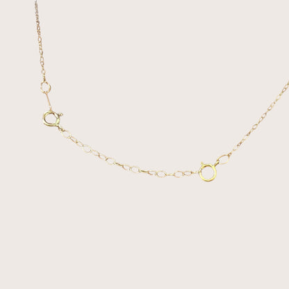 Graphic demonstrating the necklace extender attached to a gold chain to showcase custom layering length adjustments.