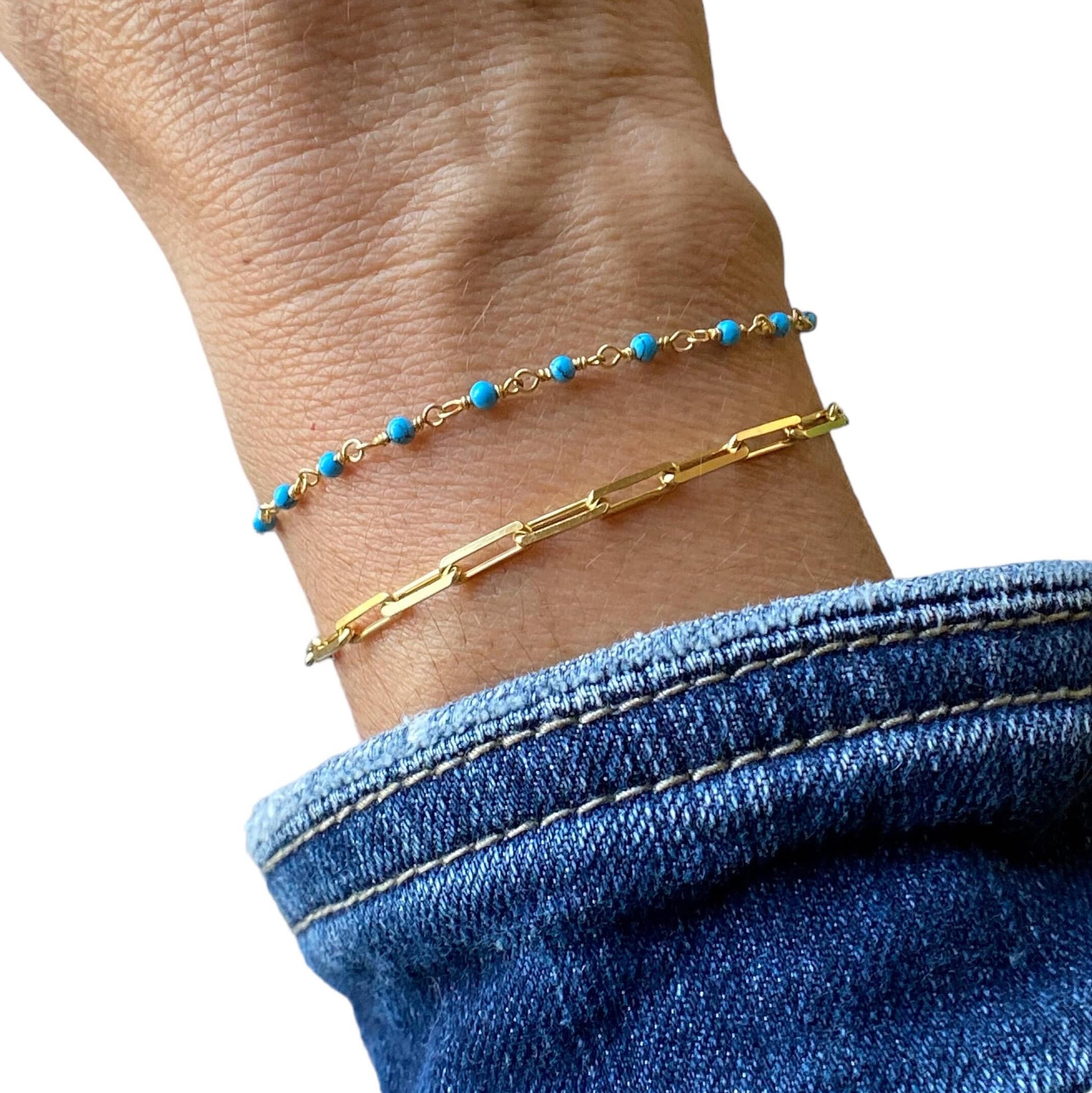 Model layering bracelets showing 14k Gold plated Serling Silver Turquoise Beaded Chain Bracelet 