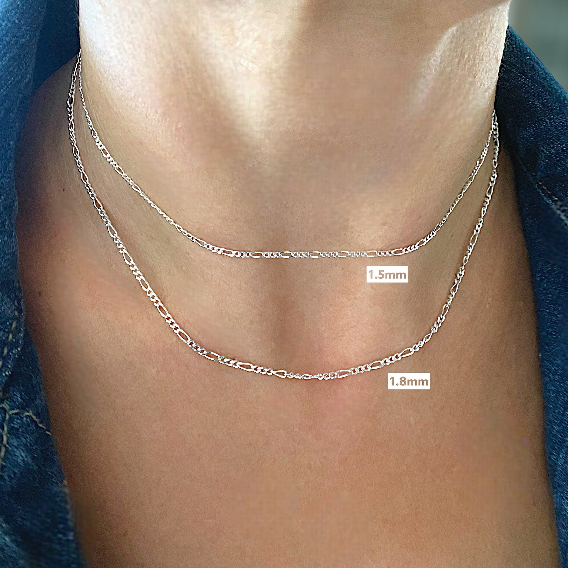Sterling Silver Figaro Chains in a bright 925 silver, model is wearing the 1.5mm and 1,8mm wide chains for reference. 