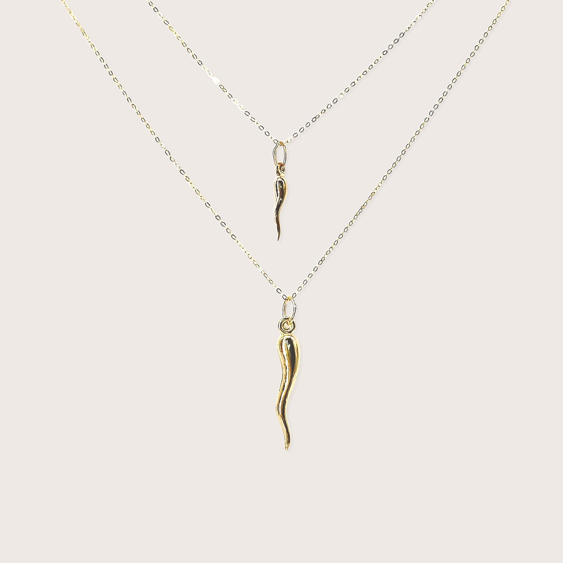 Solid 14K yellow gold large Italian horn cornicello pendant necklace on white background