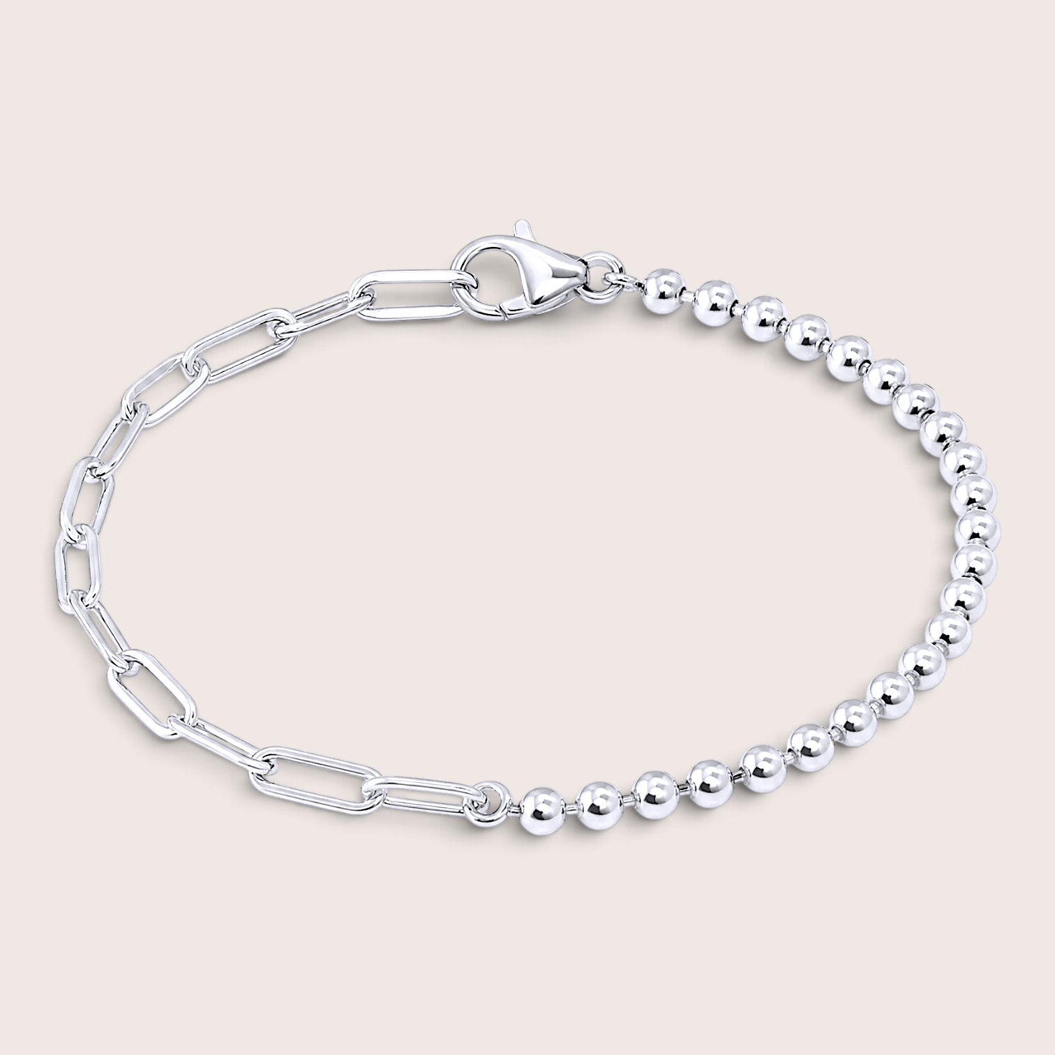 Italian mixed link chain bracelet in polished 925 sterling silver resting on a solid light background, showcasing the asymmetrical 3mm bead strand and paperclip chain.