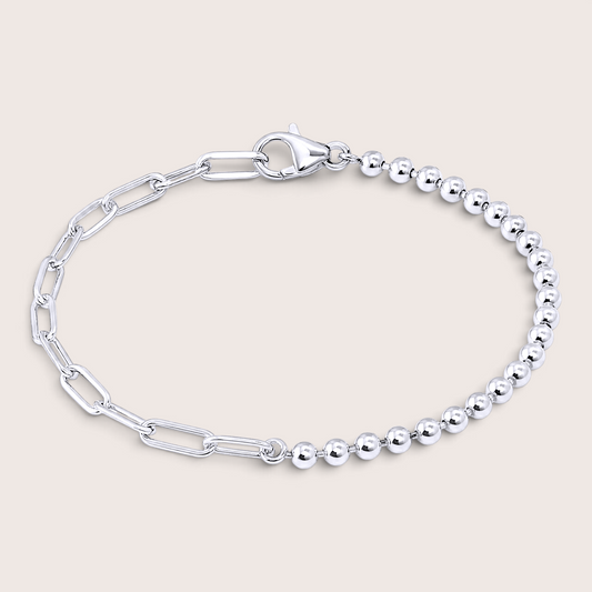 Italian mixed link chain bracelet in polished 925 sterling silver resting on a solid light background, showcasing the asymmetrical 3mm bead strand and paperclip chain.