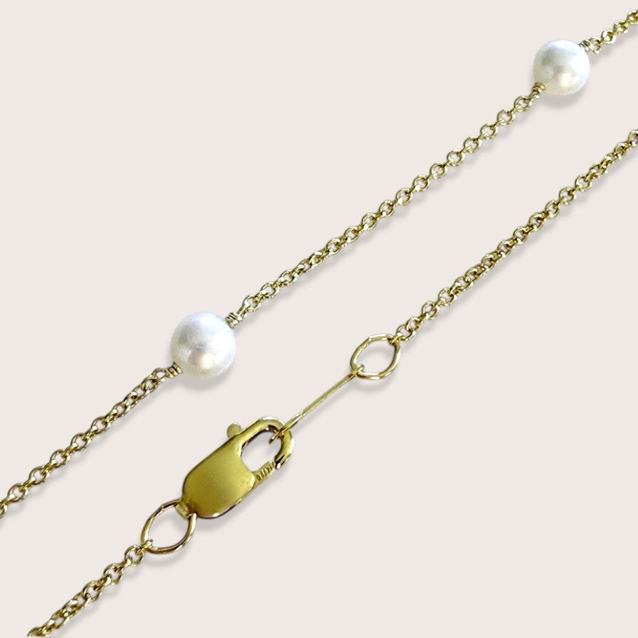 Close-up of the lobster clasp, gold-filled cable chain, and freshwater pearls