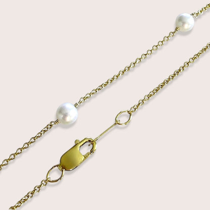 Close-up of the lobster clasp, gold-filled cable chain, and freshwater pearls