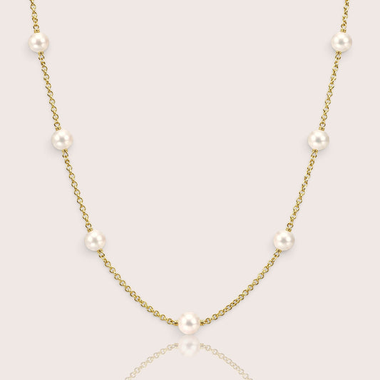 14K gold filled freshwater pearl station necklace displayed in a graceful U-shape featuring genuine ivory white pearls and wire-wrapped details