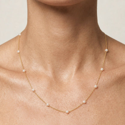 Model wearing the 18-inch gold-filled freshwater pearl station necklace