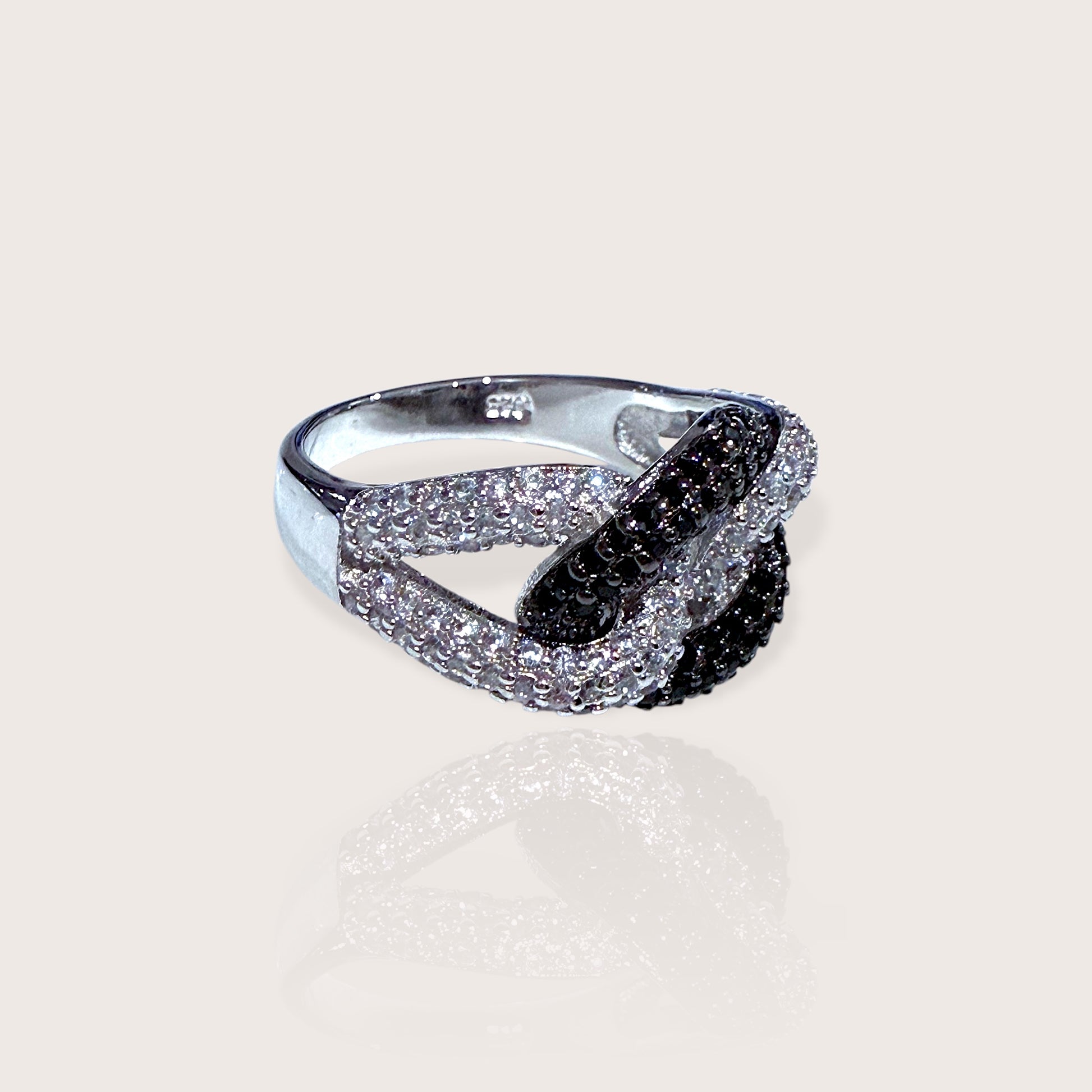 A sterling silver chain link ring featuring black and clear cubic zirconia stones set in a twisted chain design.