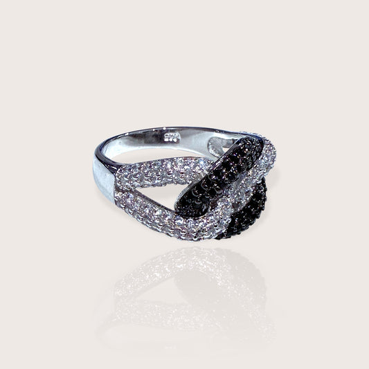 A sterling silver chain link ring featuring black and clear cubic zirconia stones set in a twisted chain design.
