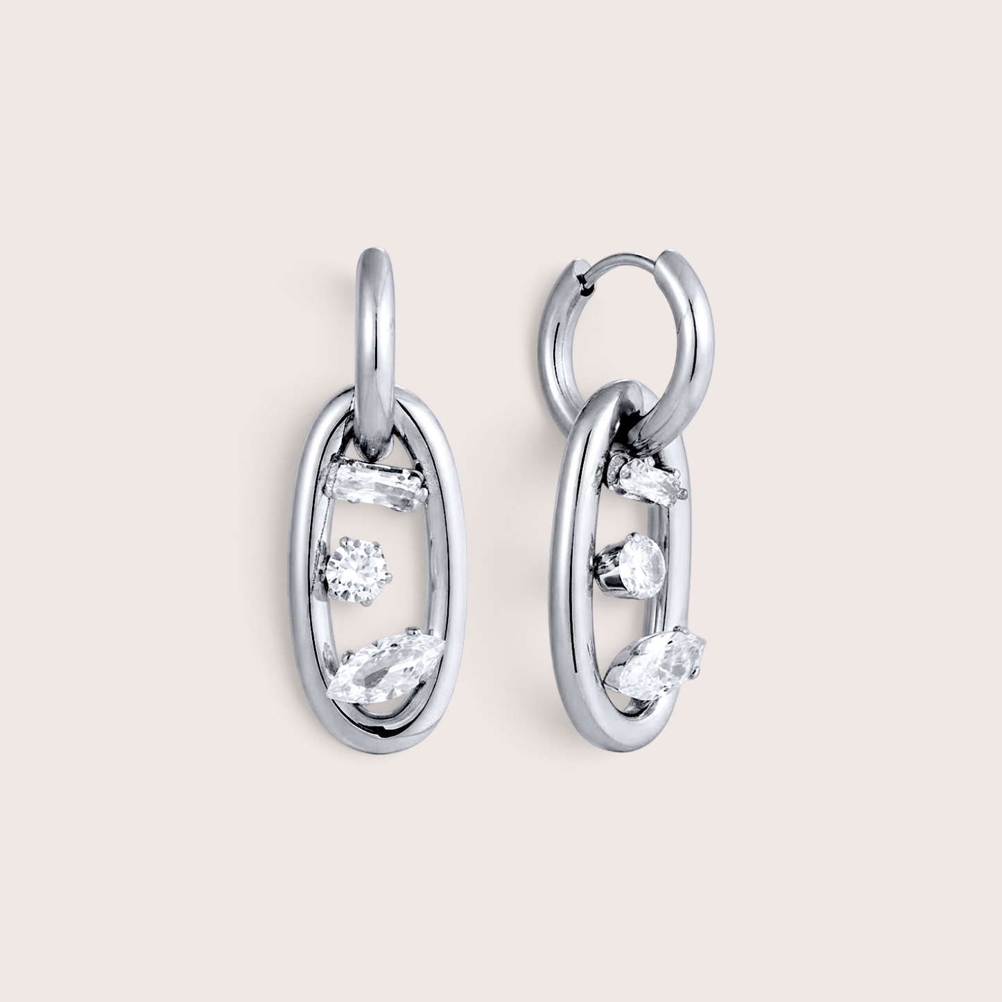 A pair of silver oval drop link earrings with openwork detailing and small clear gemstones, by Ashley Nicole Jewelry