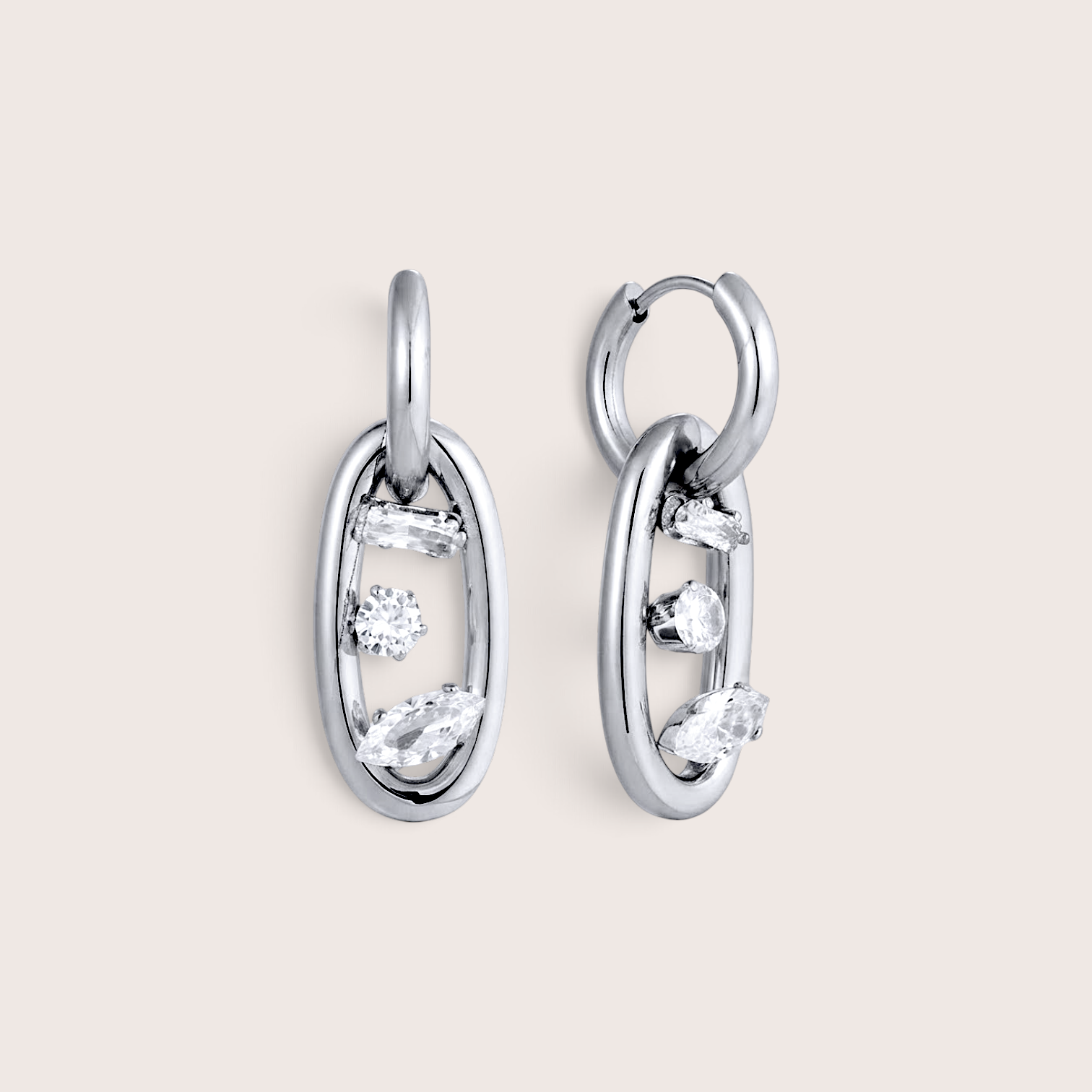 A pair of silver oval drop link earrings with openwork detailing and small clear gemstones, by Ashley Nicole Jewelry