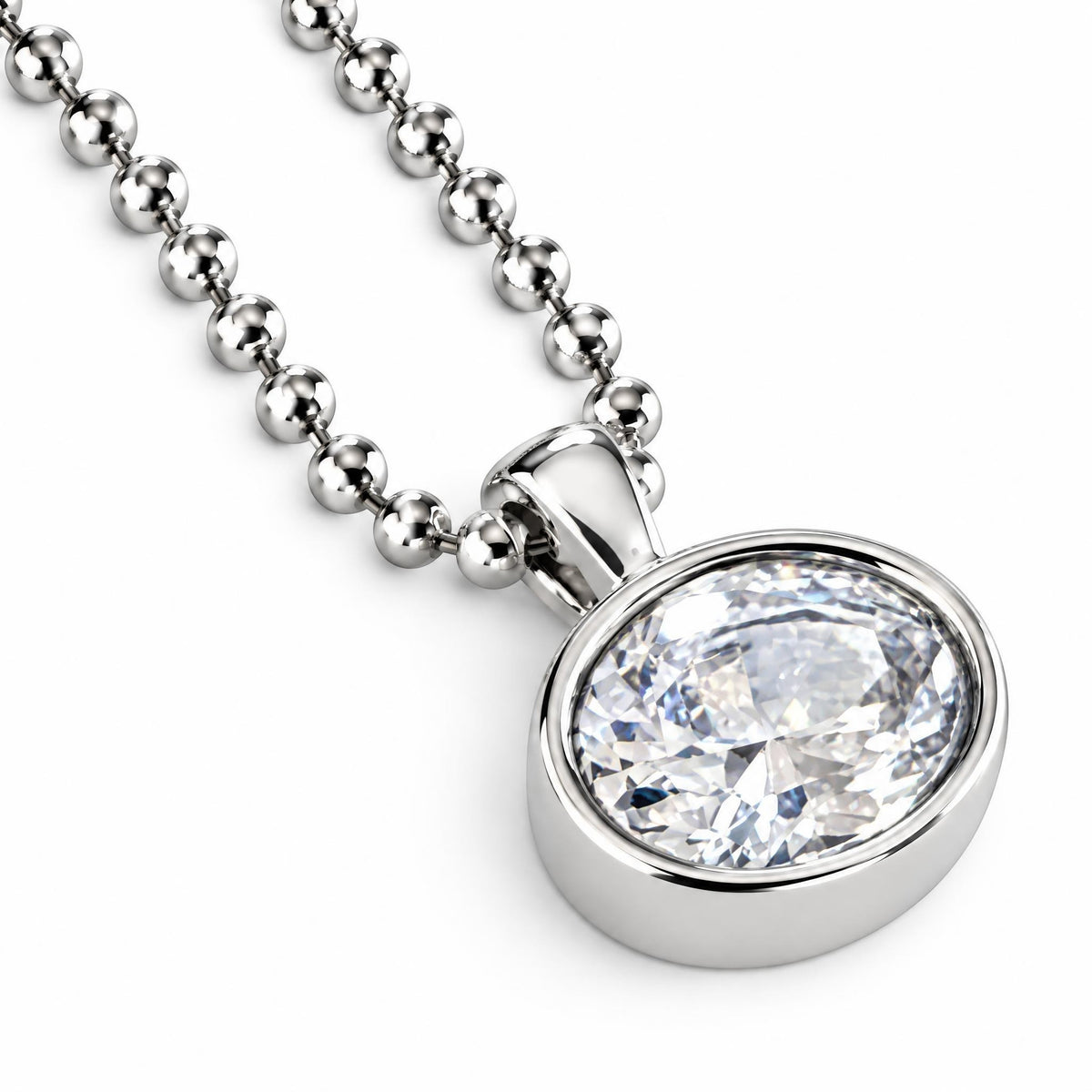 A silver ball chain necklace with an oval bezel-set clear gemstone pendant, shown on a clean white background.