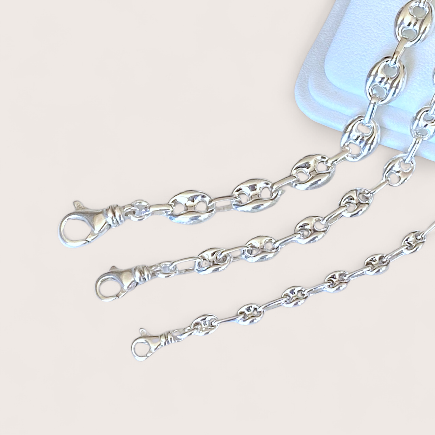  925 solid sterling silver puffed mariner anchor chain bracelet displayed together  showing lobster clasp closure by Ashley Nicole Jewelry