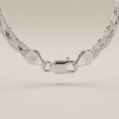 Sterling silver braided herringbone necklace clasp studio close-up