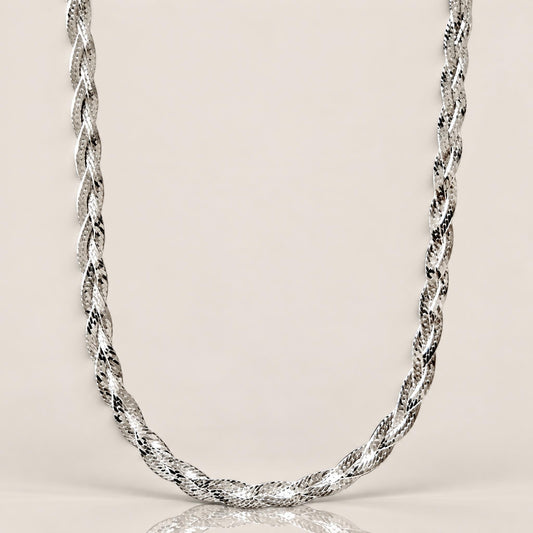 Sterling silver braided herringbone necklace arranged in an elongated U shape