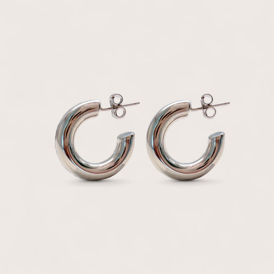 Side view of a pair of thick 925 sterling silver open hoop earrings with secure push back posts.