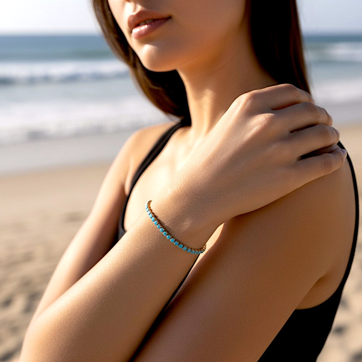 Model wearing a waterproof gold turquoise tennis bracelet 