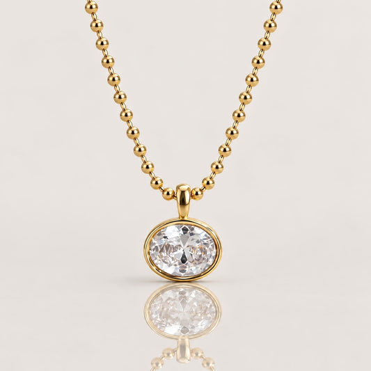 18K gold PVD stainless steel horizontal oval bezel-set cubic zirconia pendant necklace on a 2mm beaded ball chain by Ashley Nicole Jewelry